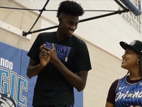 Jonathan Isaac of the Orlando Magic with a fan.