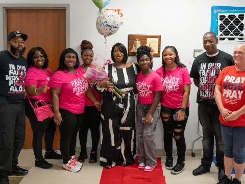 Keisha Harris rings the bell after completing chemotherapy.