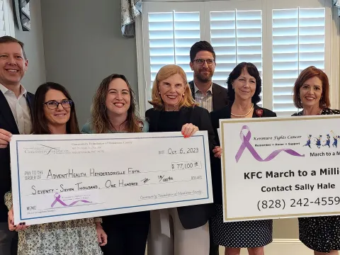 Kenmure Fights Cancer presents check to AdventHealth Hendersonville Foundation.