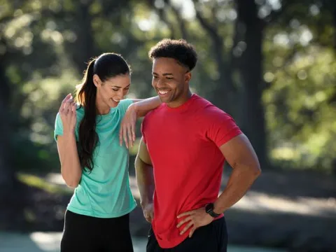 young adults active outdoors smiling