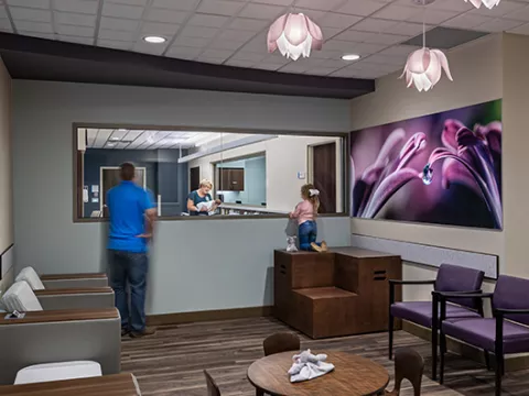 Family viewing a newborn baby in a nursery at AdventHealth Gordon