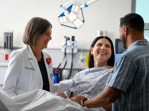 a patient and her dcotor smiling
