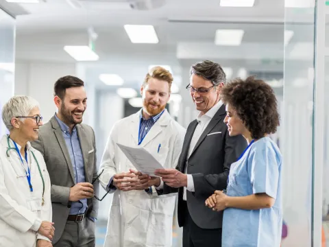 Pharmacists and care team collaborating