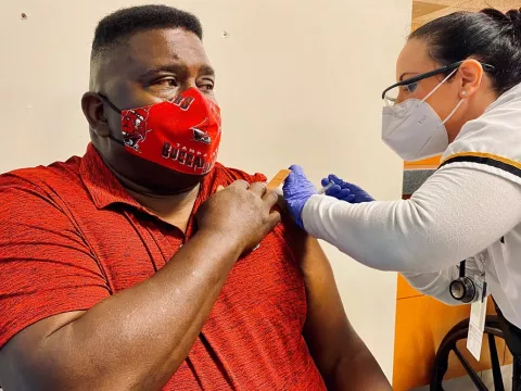 Patient gets COVID-19 vaccination 