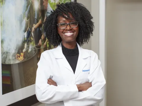 Dr. Rachel Harris, cardiologist stands and smiles