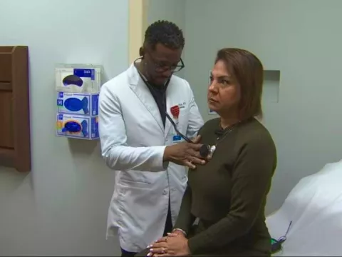 Dr. Linus Wodi seeing patient Reena Caprario at AH Apopka.