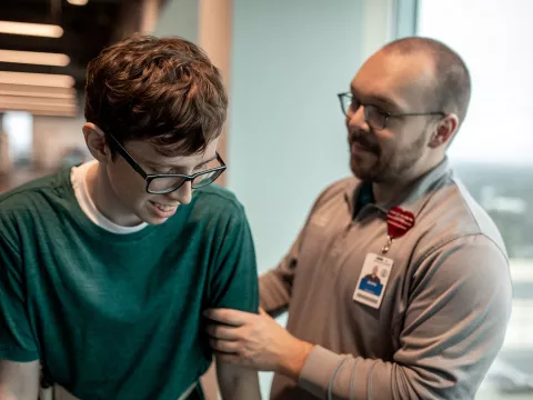 A boy at a Sport Medicine and Rehab appointment with a specialist.