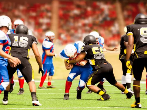 Athletes playing football