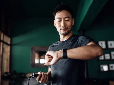 A man checks his heart rate on his smart watch.