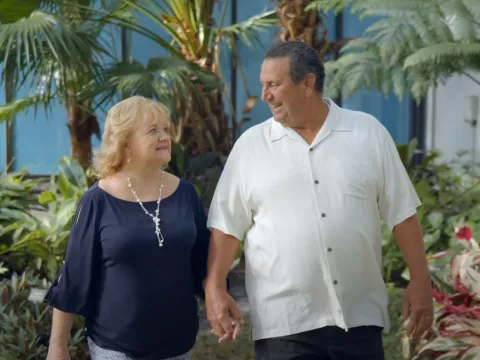 Susan and her husband walking together.