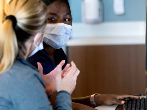 A doctor and patient discuss care needs.