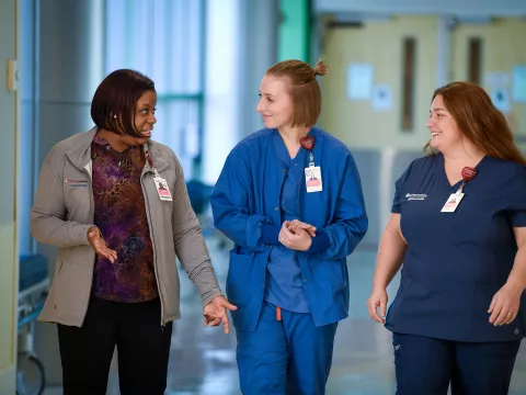 UCMAH Nurses Talking to Each Other in Hospital Hall