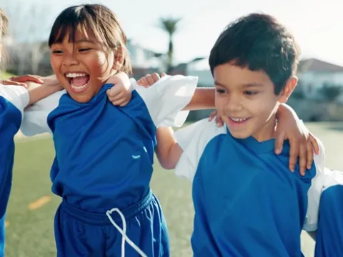 Young children playing sports.