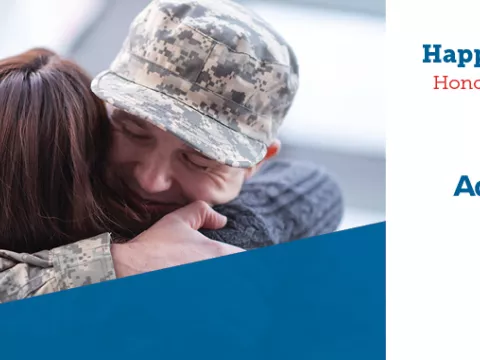 a soldier hugs a family member