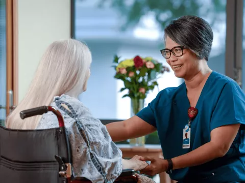 An older woman with her home care provider.