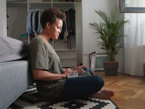 A woman doing research on her computer.