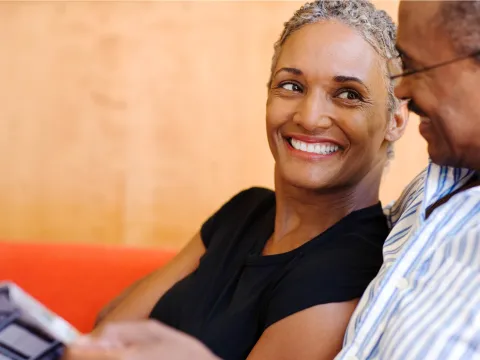 A wife smiling at her husband.