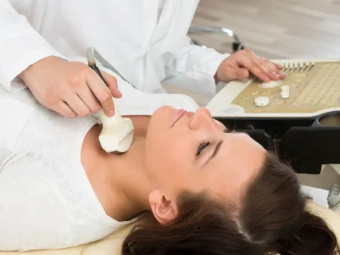 Physician about to perform ultrasound on patient.