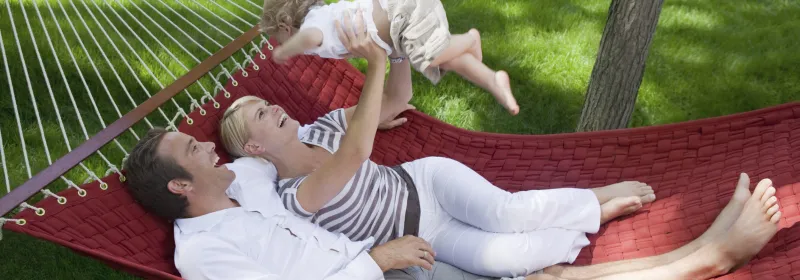 A family enjoys time outside together in the summer.