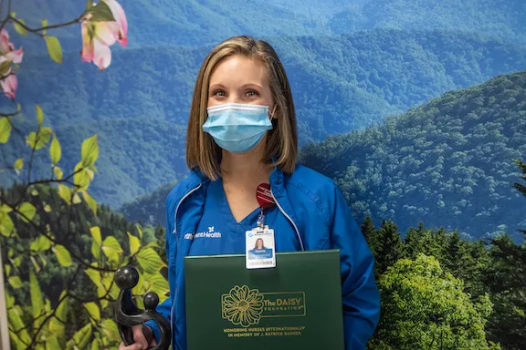 cassie ferguson holds award