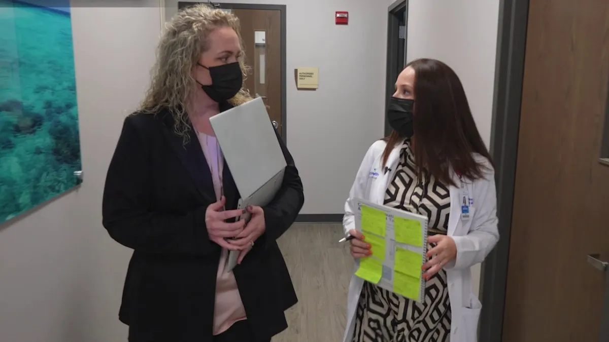 Valeria Baldivieso, M.D. consults with medical staff on a patients test results as part of the Davos Alzheimer's Collaborative study.