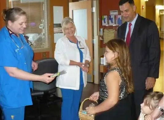 John and his nieces handing out cookies to the team that helped Timothy.