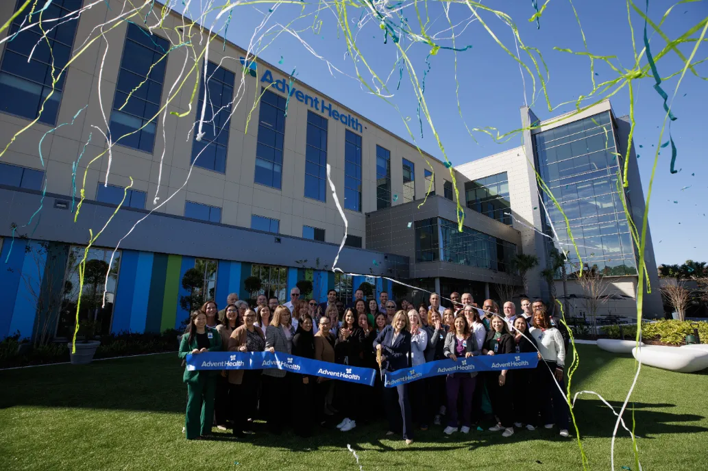 Team members cut the ribbon to officially open AdventHealth Minneola.