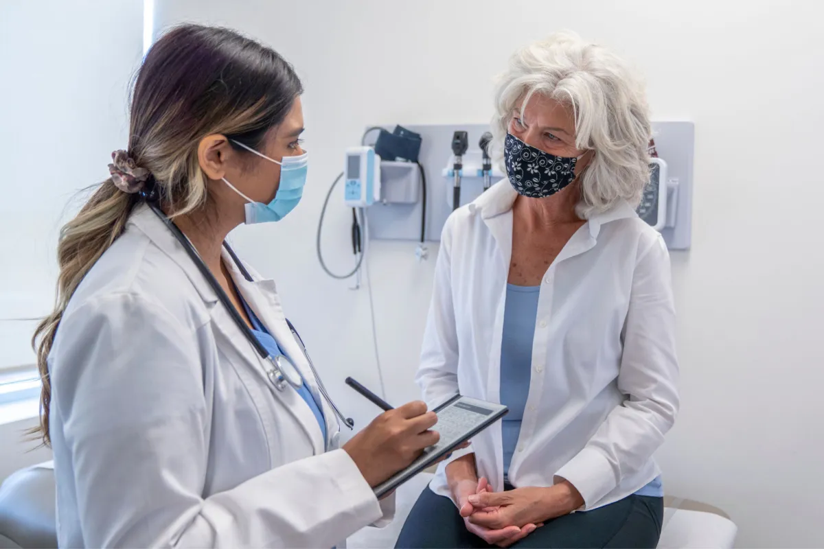 A female patient listening to her female physician.