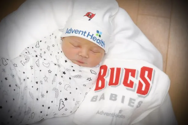 A 2021 newborn baby having clothes that show support for the Tampa Bay Buccaneers