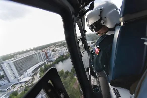 1.	Todd Collette, RRT, scans the approach to AdventHealth Orlando as a Flight 1 helicopter brings a mock patient to the emergency room. 