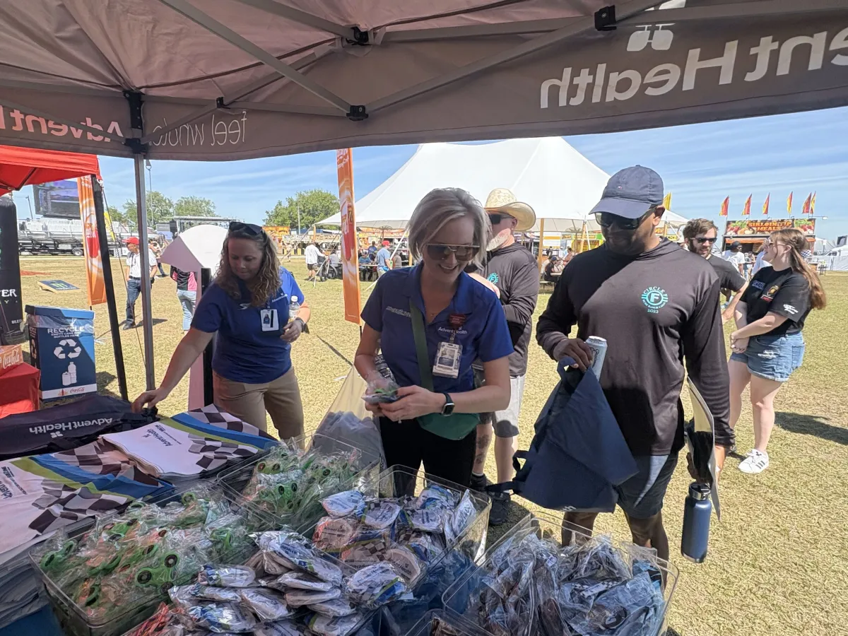 (From L-R) AdventHealth Sebring/Wauchula/Lake Placid Chief Medical Officer Dr. Victoria Selley and AdventHealth Wauchula Vice President and Administrator Christen Johnson were among the team members handing out items to attendees at Sebring International Raceway.