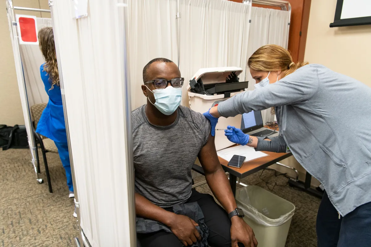 Man receives Pfizer COVID19 Vaccinations at AdventHealth Daytona Beach