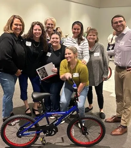 Group of people with a bike.