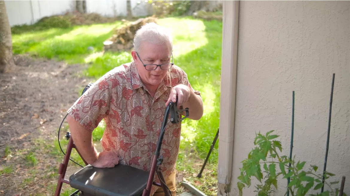 Chris Robinson, Operation Walk USA patient, in the garden.