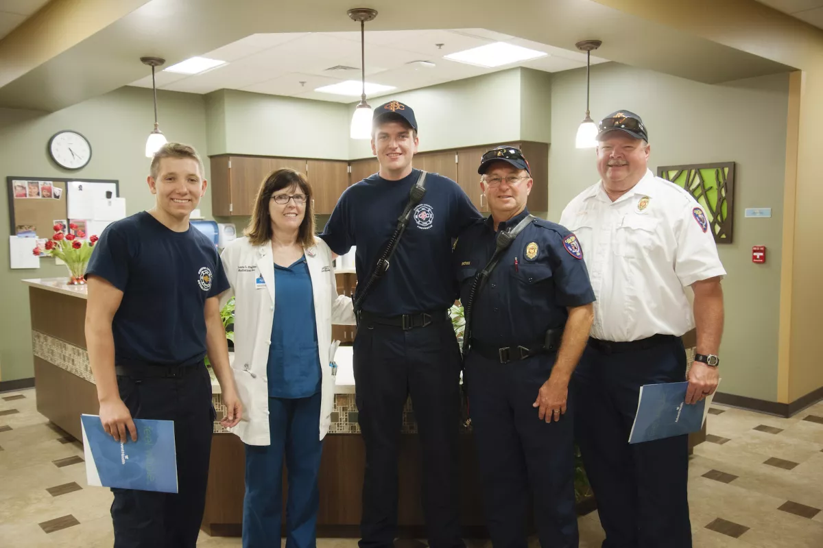 Dr. Hughes and firefighters