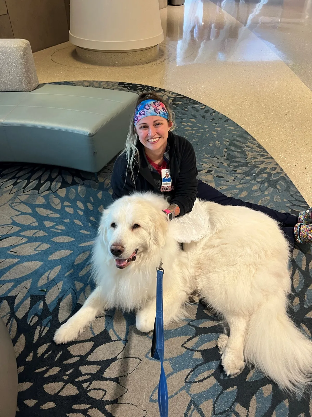 Duke McDreamy comforts an AdventHealth team member. 