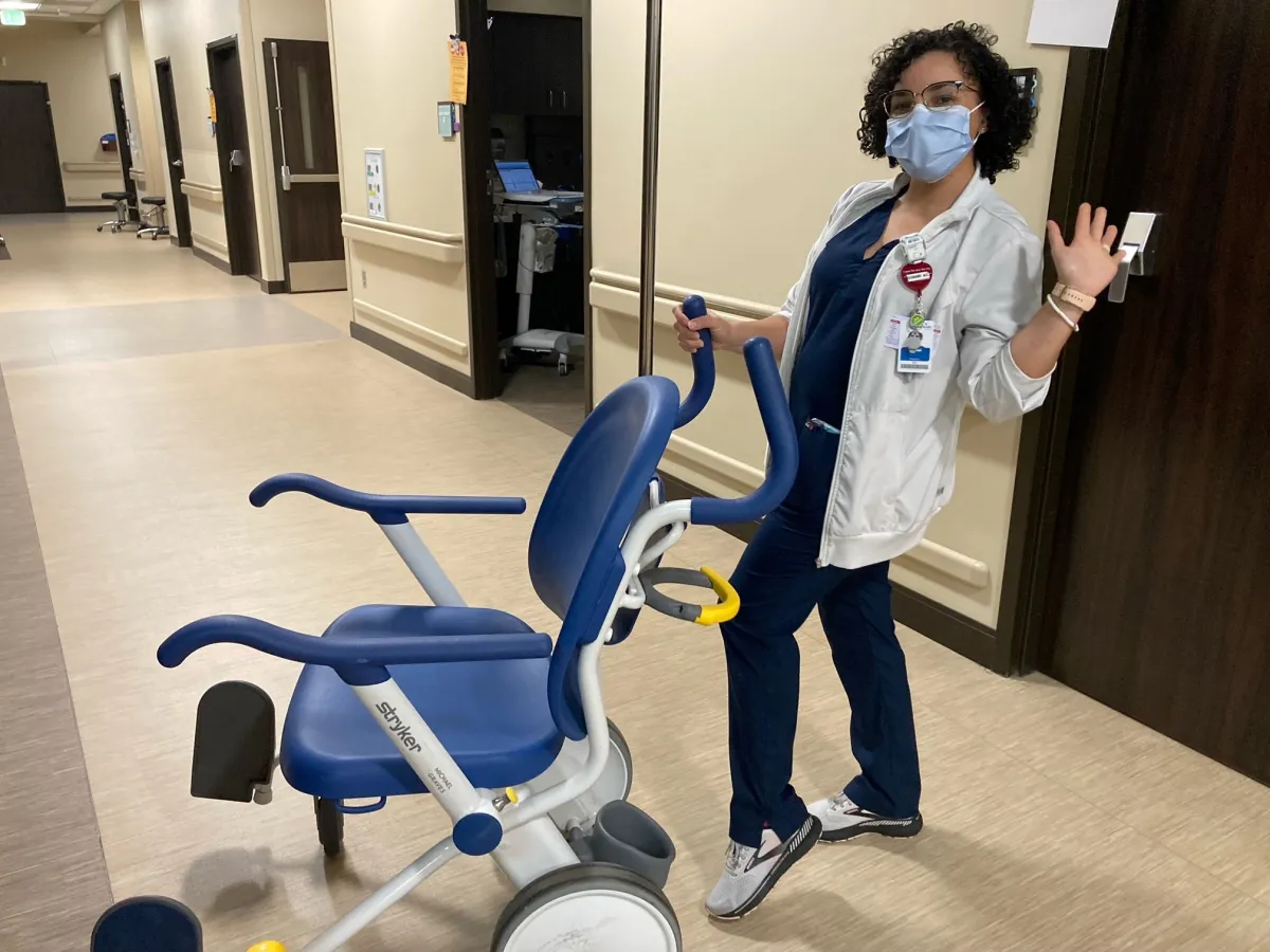 You can almost see the smile through her mask.