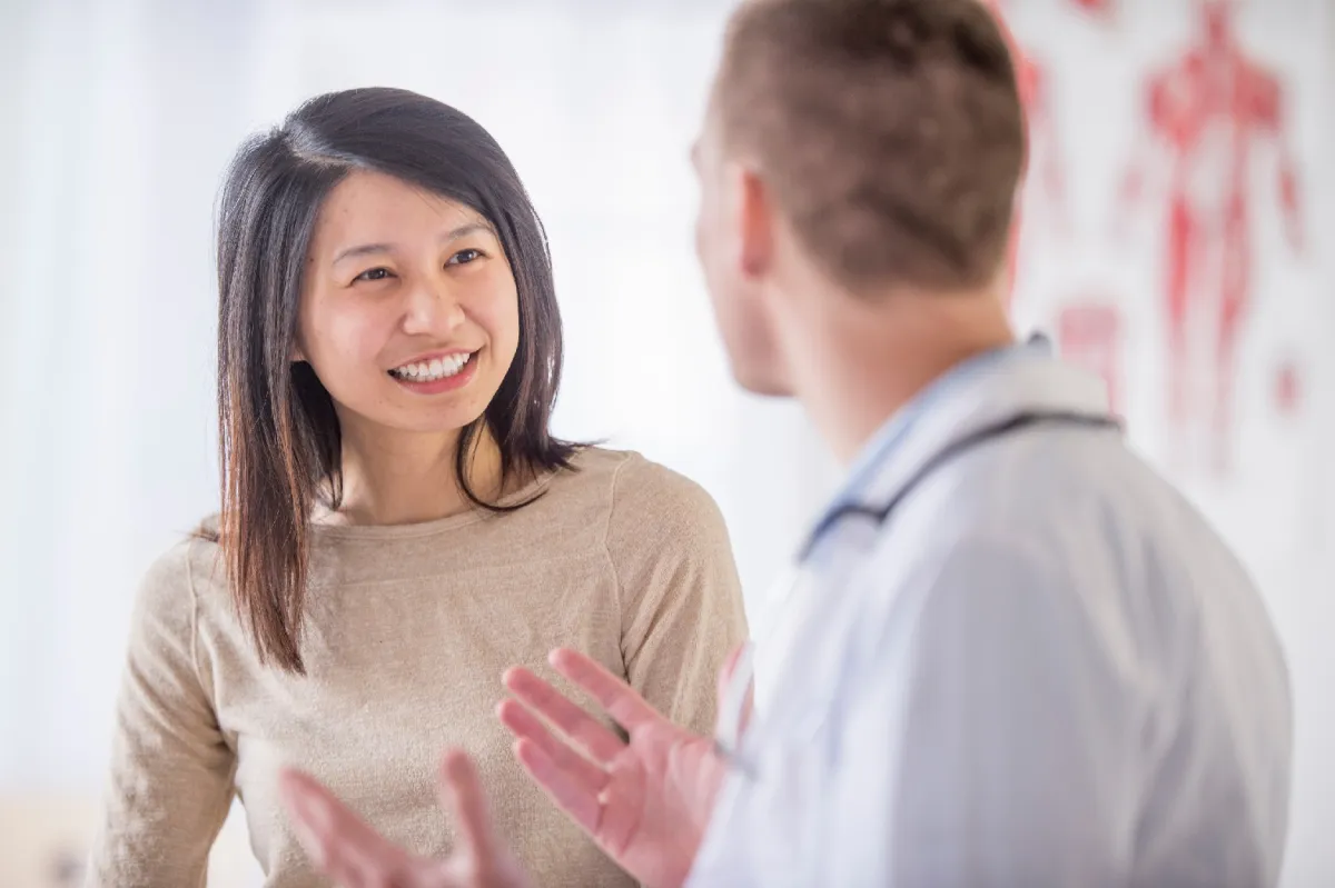 Patient talking with her doctor.