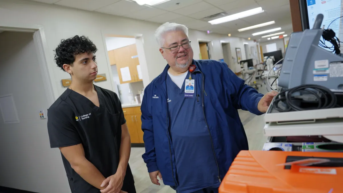 Nicholas Muneaton, a senior at UCF, and said Ian Barnett, RN, assistant nurse manager 