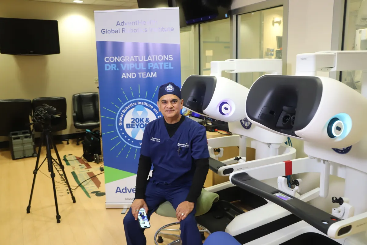 Dr. Vipul Patel sits at a console after completing a robotics surgery
