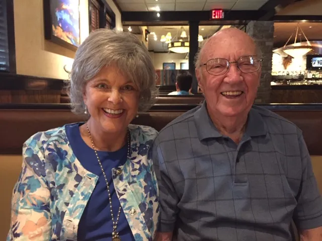 Peggy sitting with her husband, Gerald