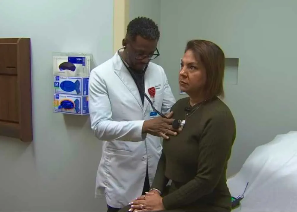 Dr. Linus Wodi seeing patient Reena Caprario at AH Apopka.