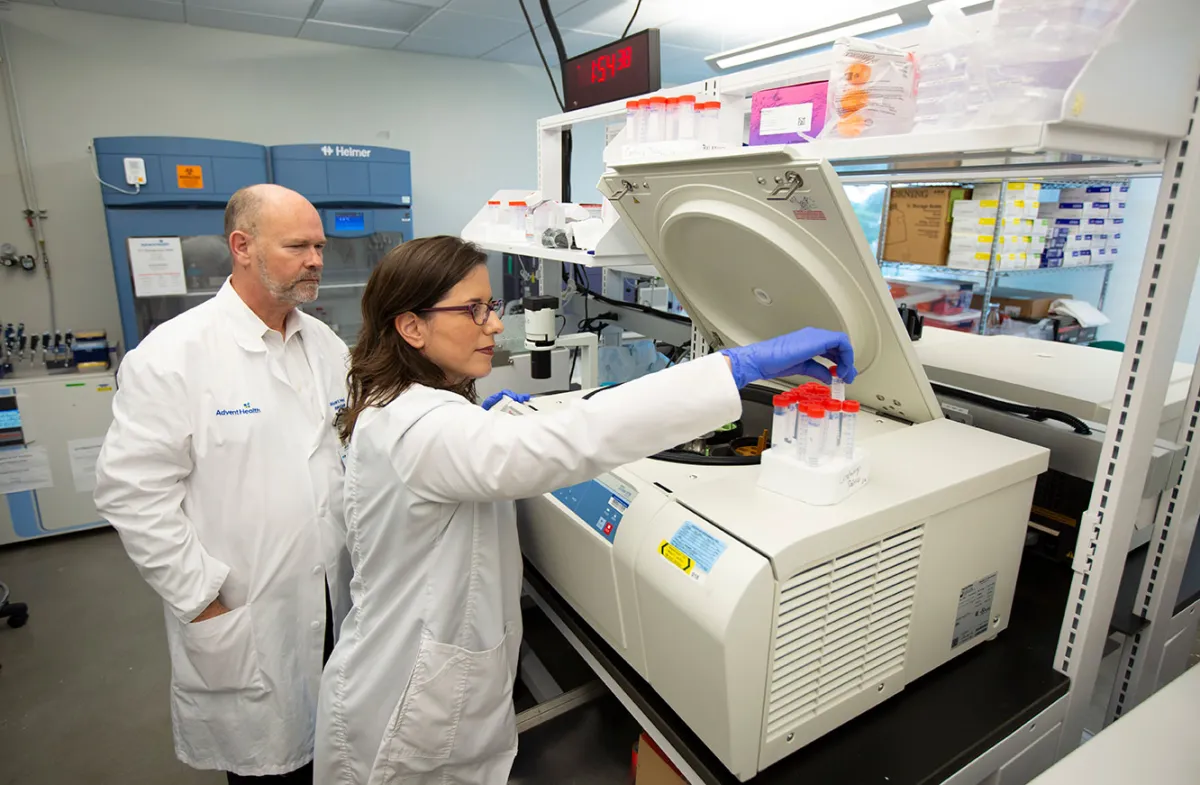 dr prayley looking over a study