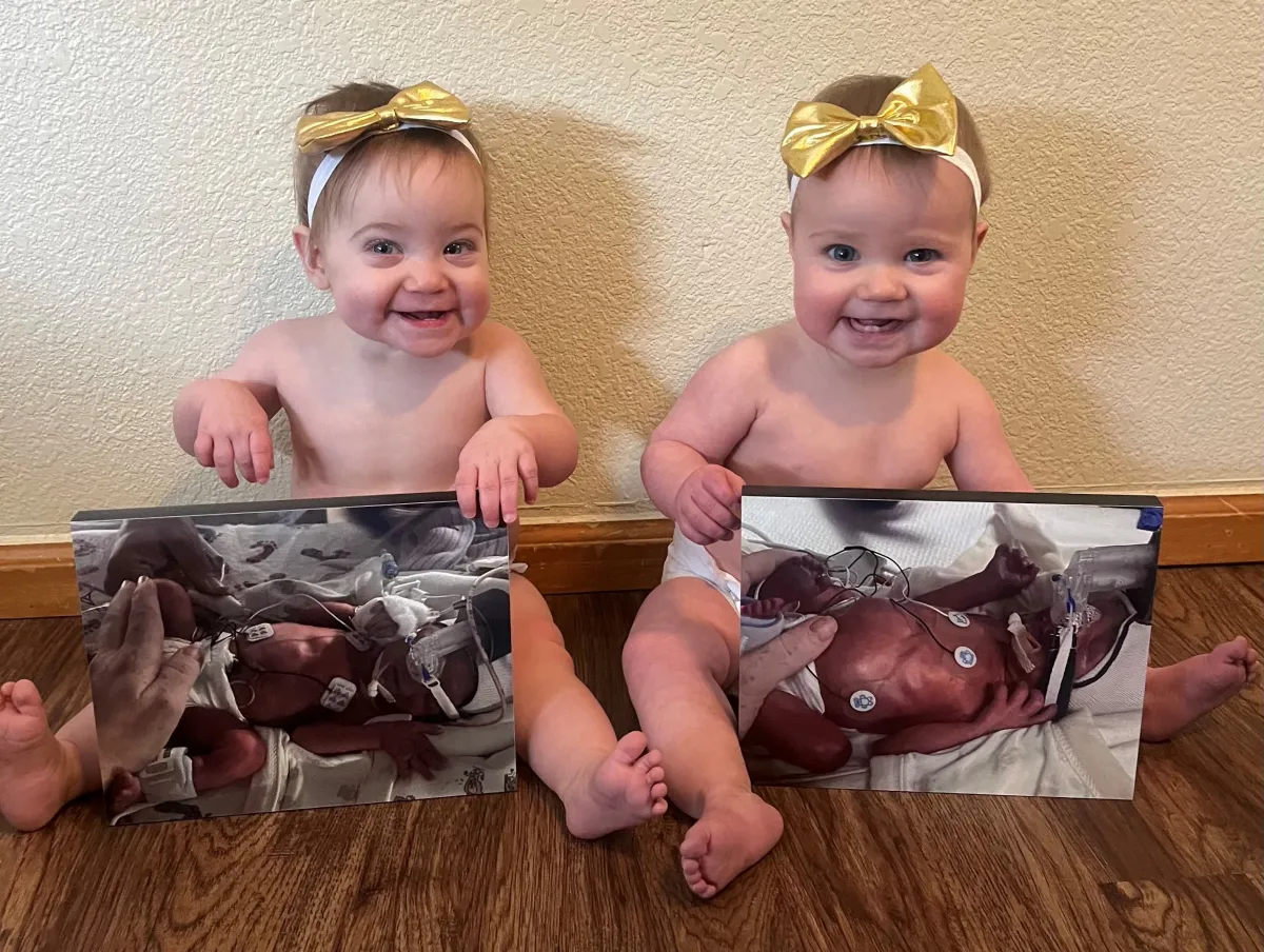 Two babies pose with photos of them as newborns in the NICU