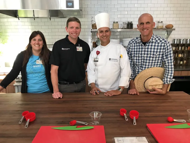 A group of AH employees in a kitchen.