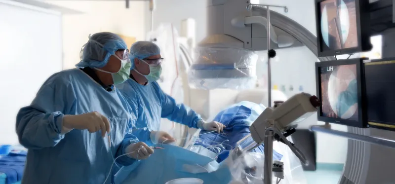 Two surgeons performing a mock surgery