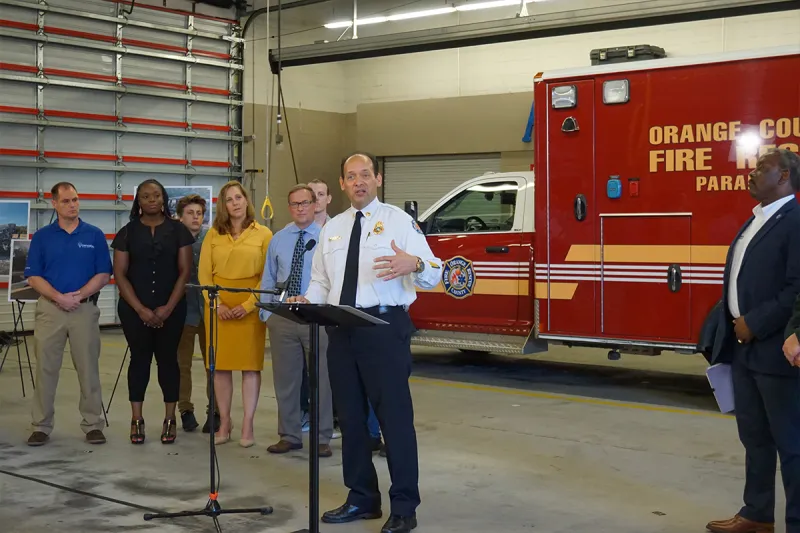 A man giving a speech at the Fire department