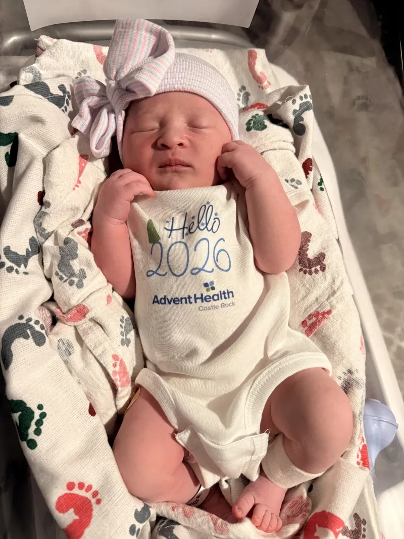 Baby Eliza arrived at 12:21 a.m. Jan. 1, 2026. She is seen in a baby outfit atop a blanket.