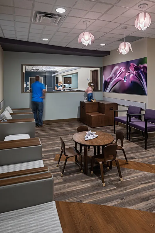 Family viewing a newborn baby in a nursery at AdventHealth Gordon