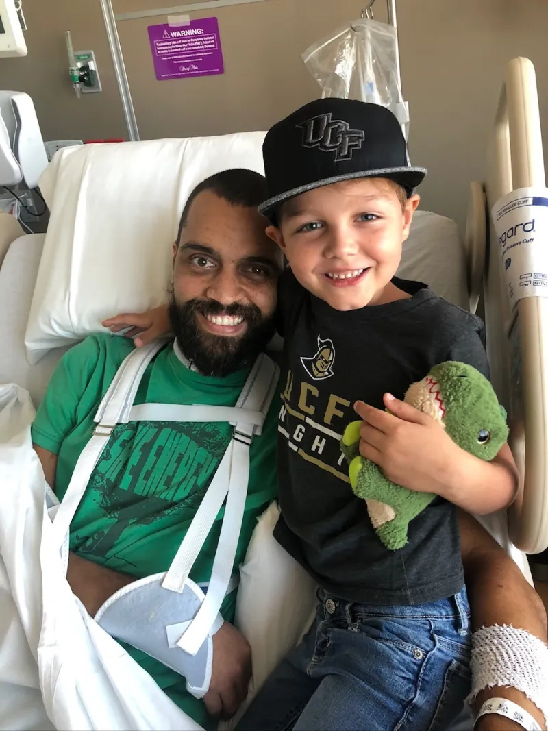 Brandon in the hospital with his son
